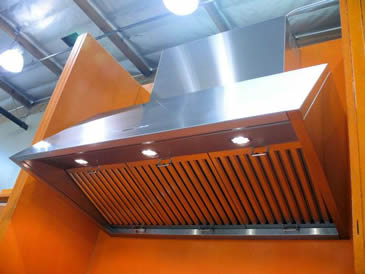 Three stainless steel baffle grease filters are installed at kitchen