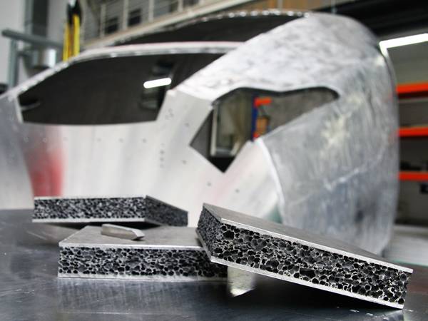 There are three pieces of aluminum foams in front of the train model.